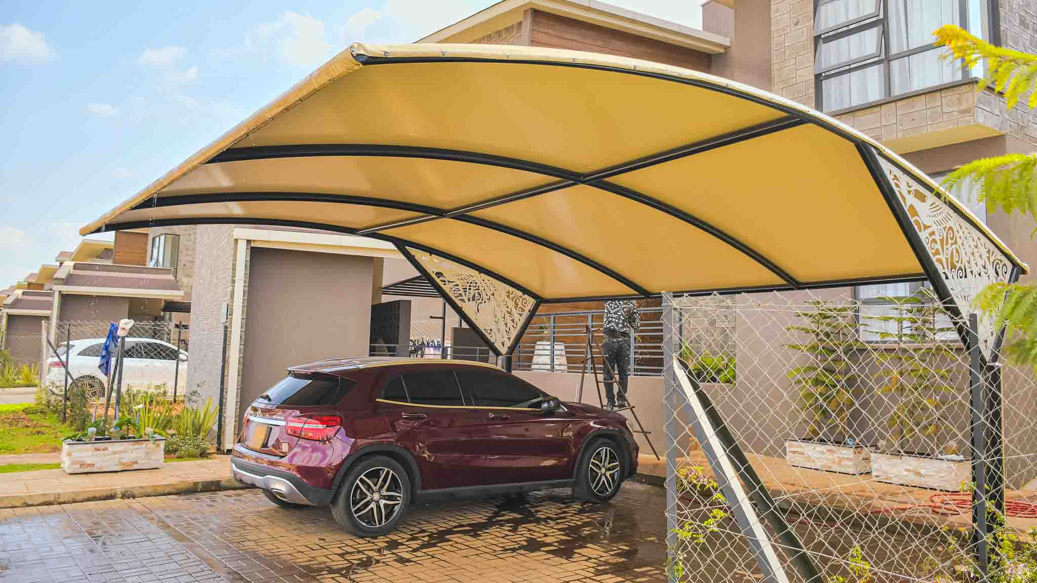 Curved car parking shade blending with a modern home in Karen, Nairobi