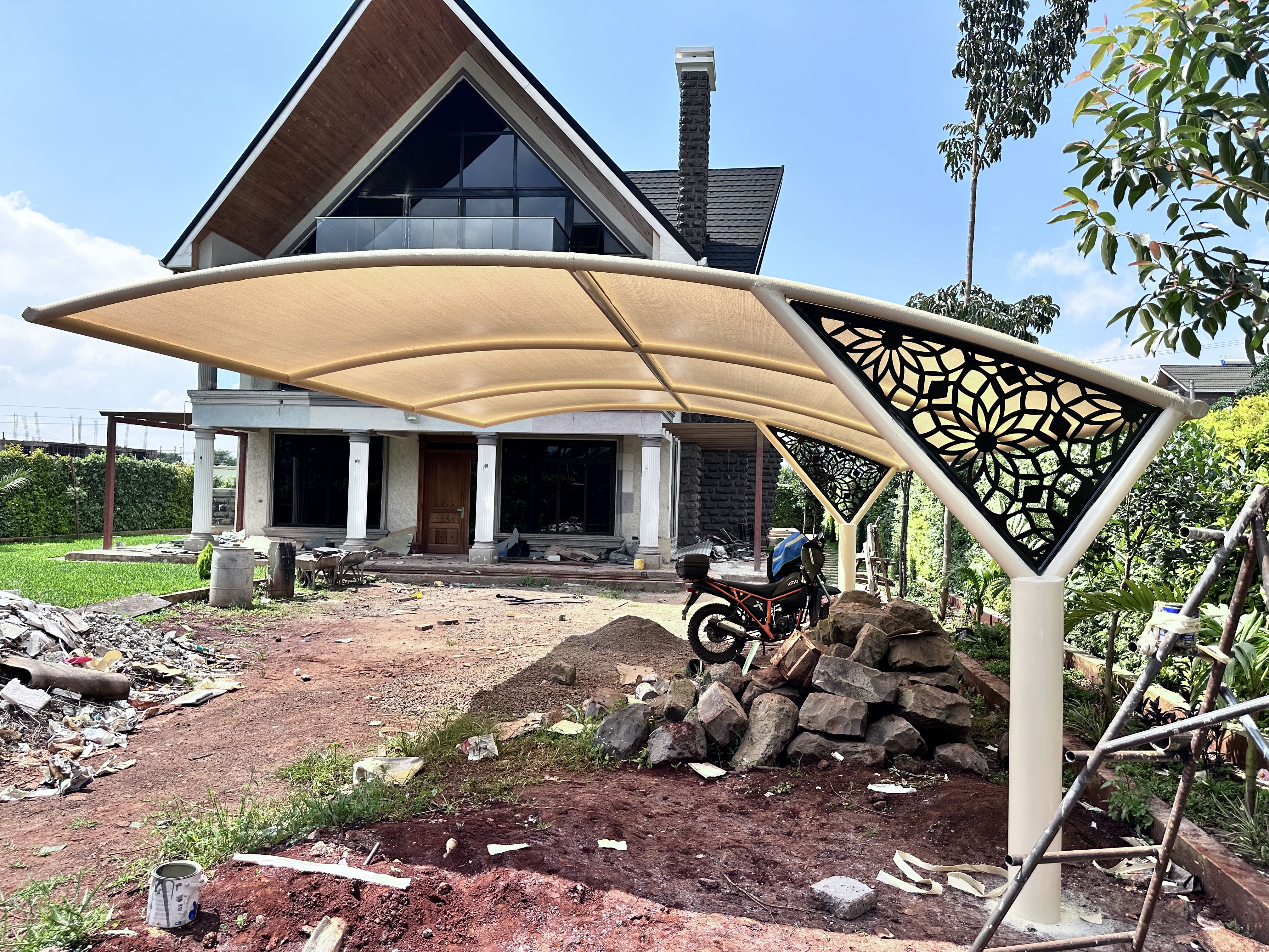 Curved cantilever car parking shade at Mr Priyesh residence, Nairobi
