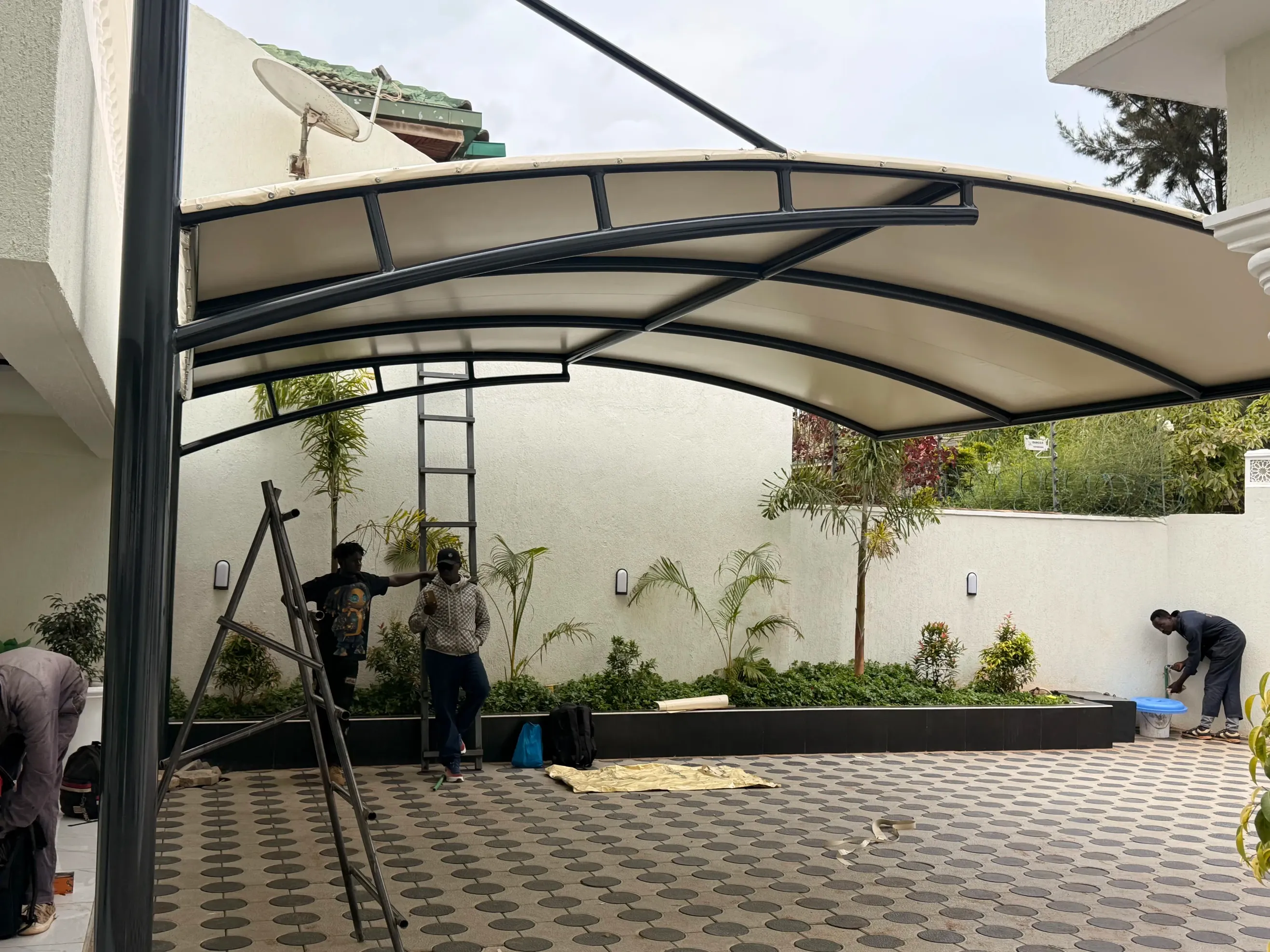 Curved car parking shade blending with a modern home in Karen, Nairobi